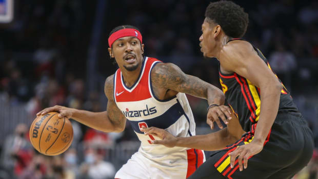 Nov 1, 2021; Atlanta, Georgia, USA; Washington Wizards guard Bradley Beal (3) is defended by Atlanta Hawks forward De'Andre Hunter (12) in the second quarter at State Farm Arena. Mandatory Credit: Brett Davis-USA TODAY Sports
